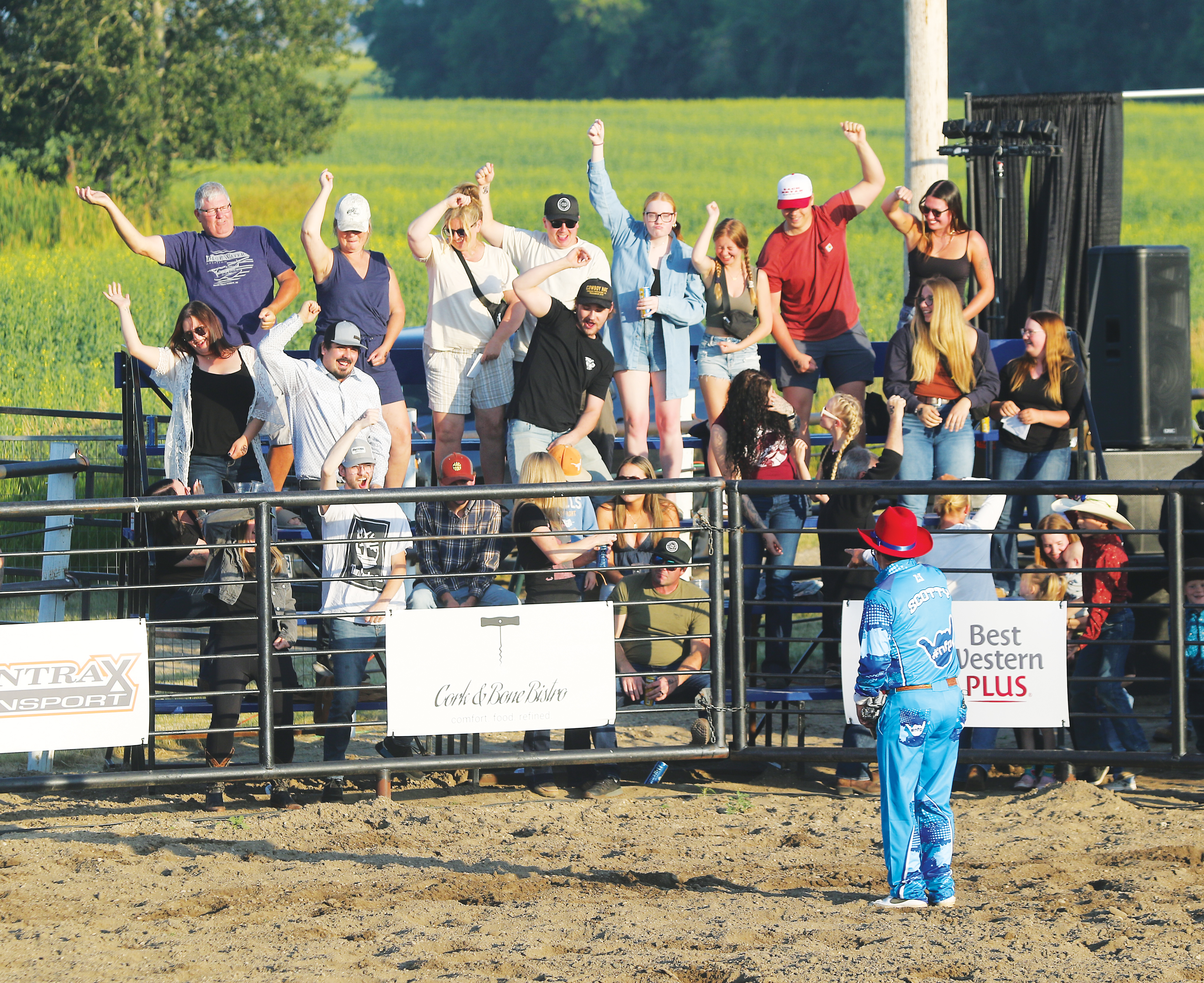 A Rodeo clown gets the crowd excited.